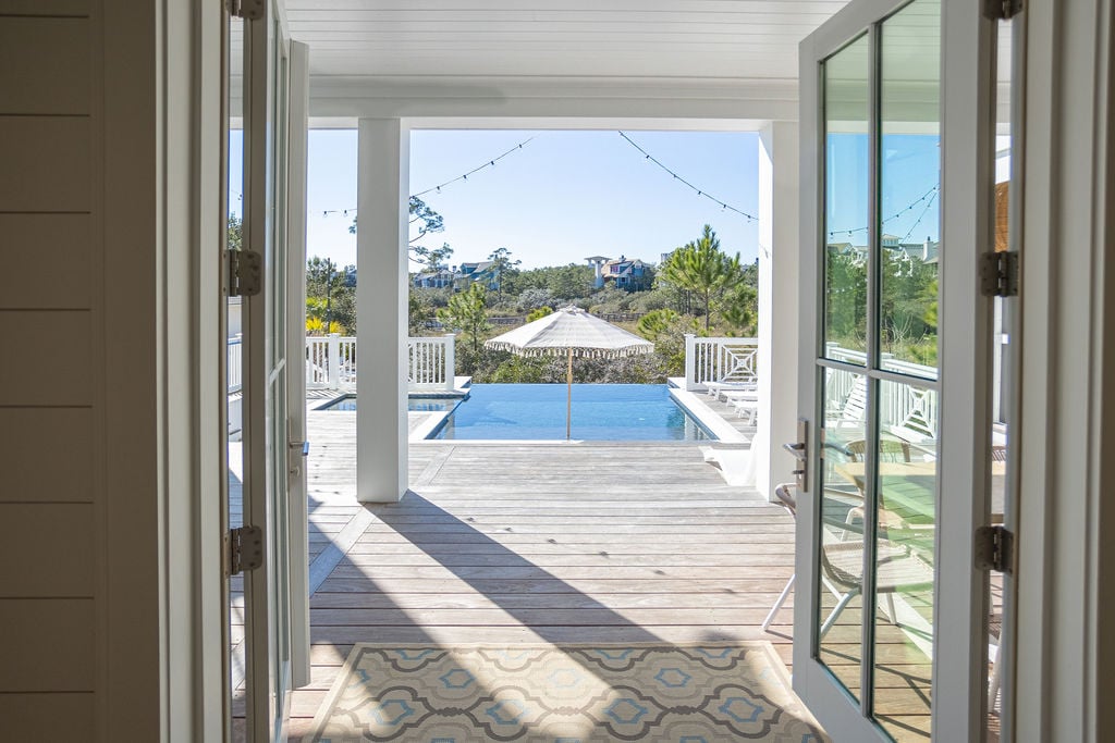 Double doors off kitchen for access to large deck, pool, and spa.