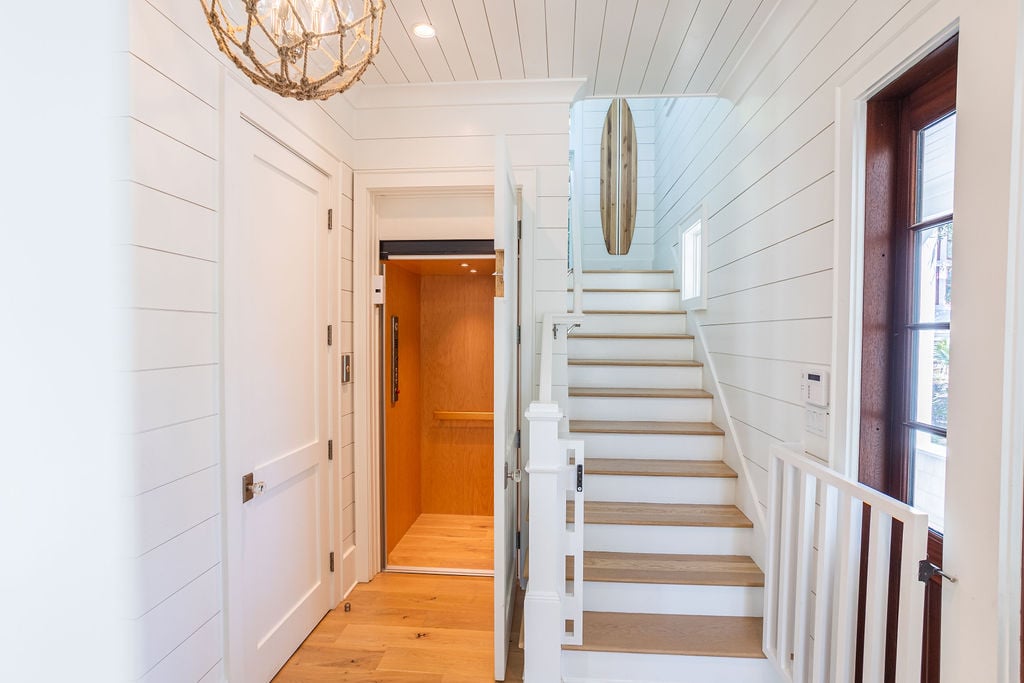 First walking in through front door there is a foyer with steps to second floor bedrooms. There is an elevator available for handicap access.