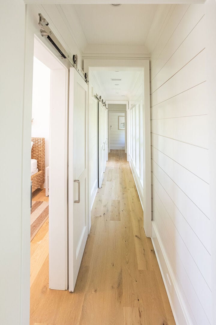 Hallway upstairs to remaining second floor bedrooms.