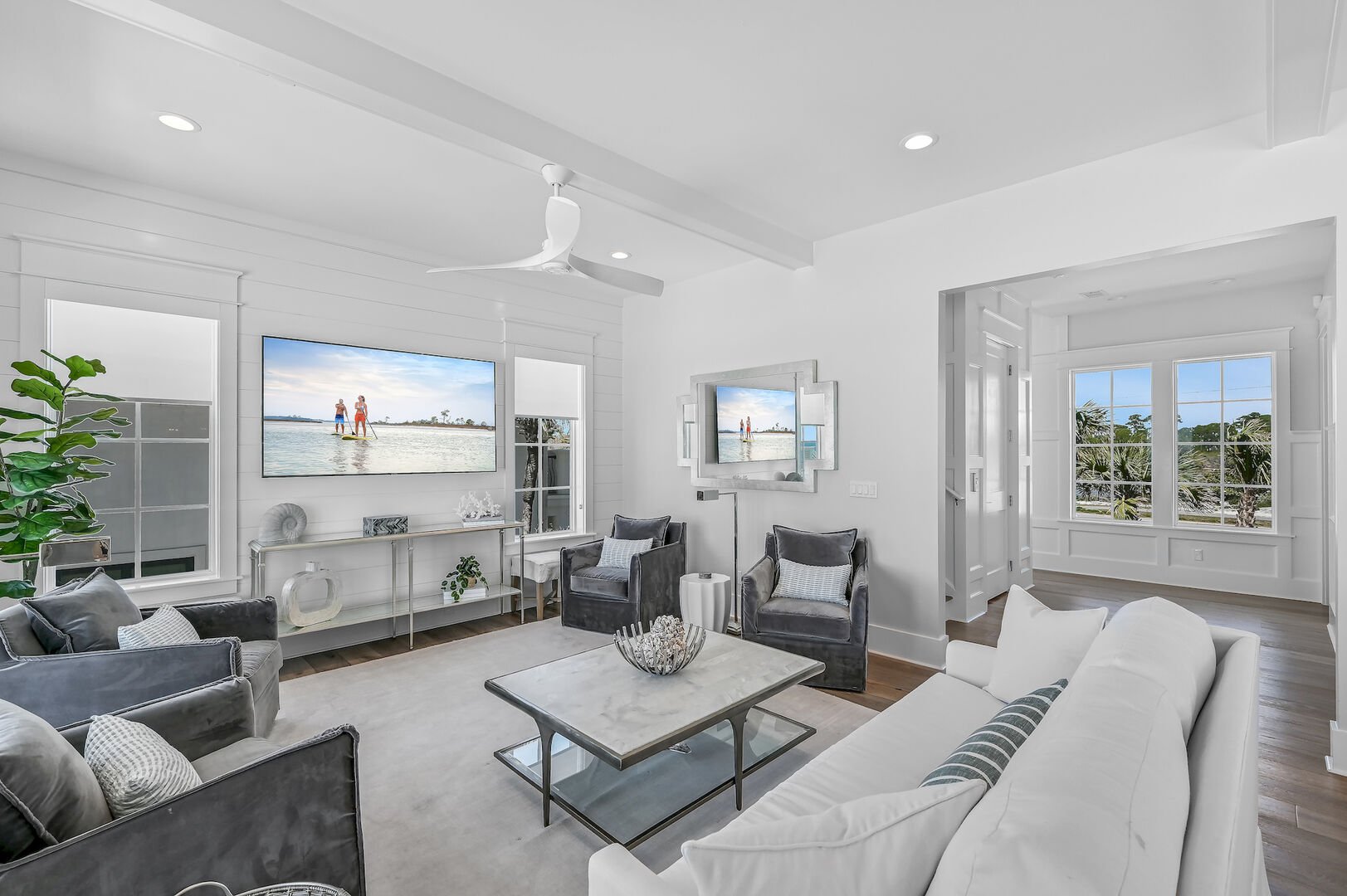 Living area offers plenty of seating and a 75