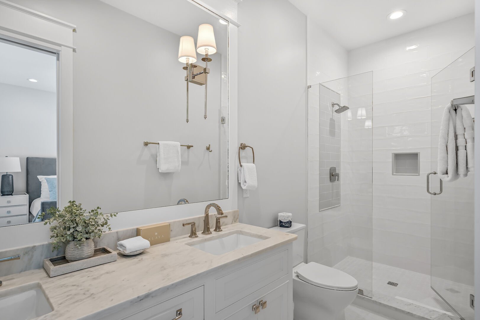 Ensuite for bedroom features a large walk-in shower.