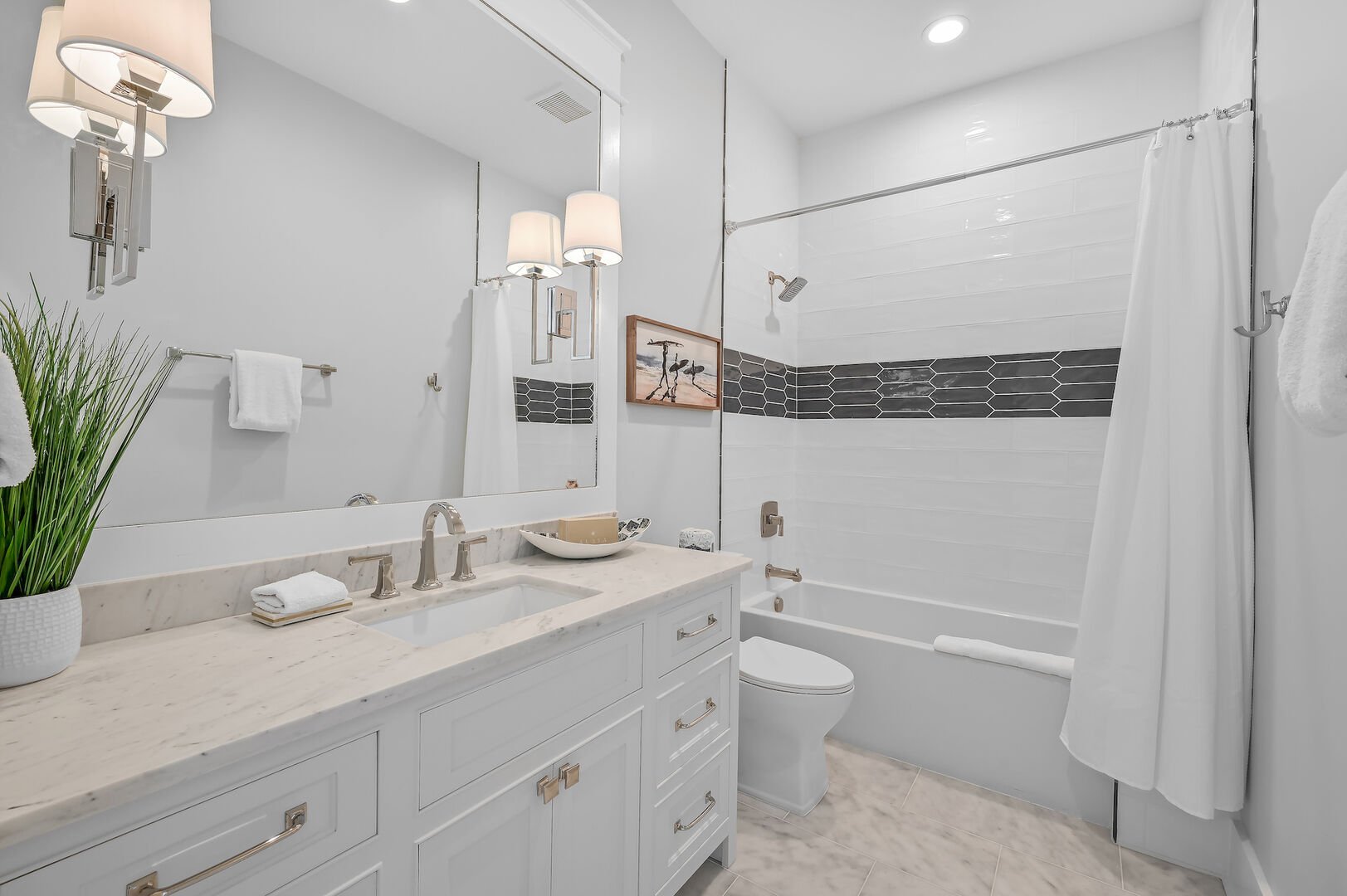 Bedroom ensuite features a shower/tub combo.