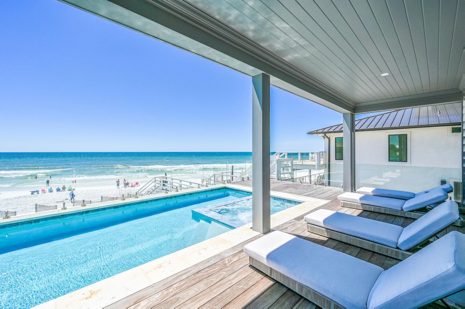 Private pool with a built-in sitting spa and 4 loungers. Outdoor patio also features an outdoor kitchen for grilling!