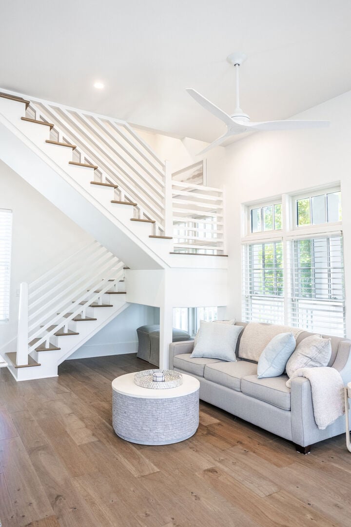Stairs in carriage house to second floor. Living area features a Queen sleeper sofa.
