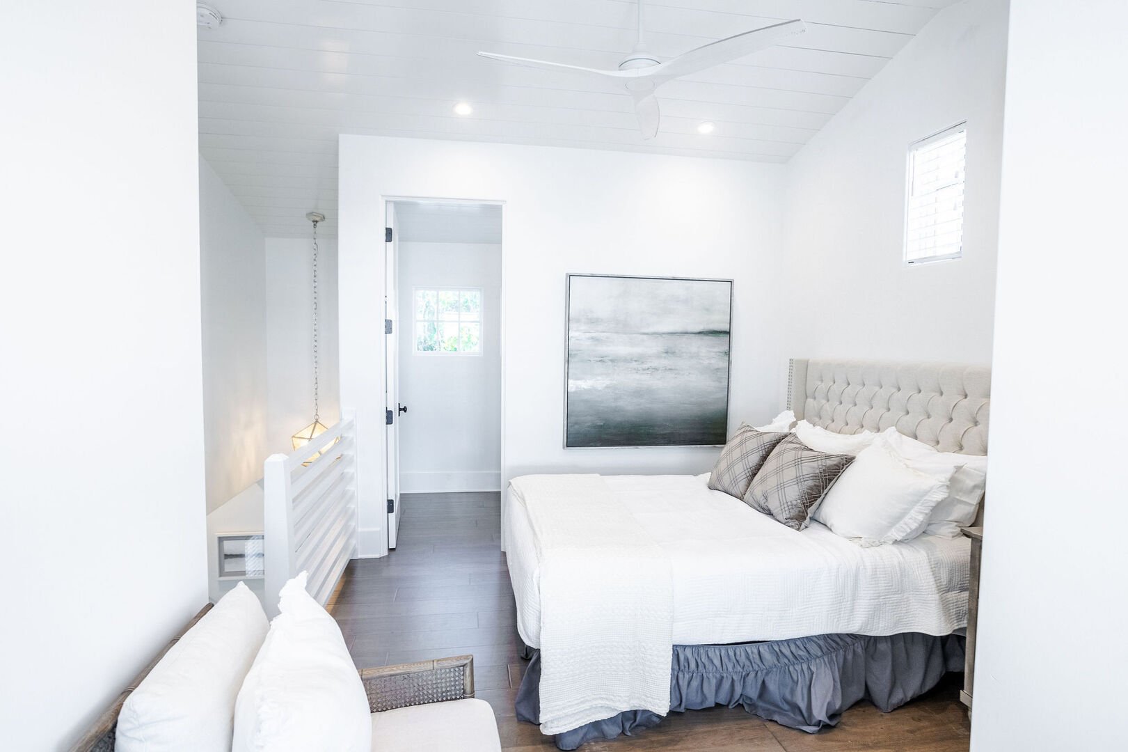 Bedroom in carriage house loft has a walk-in closet and bathroom.