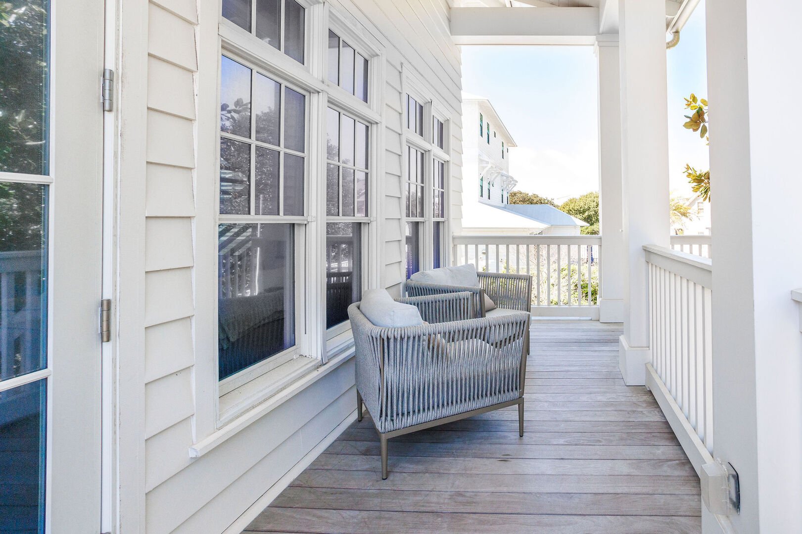 Carriage house front porch with seating to enjoy your morning coffee!