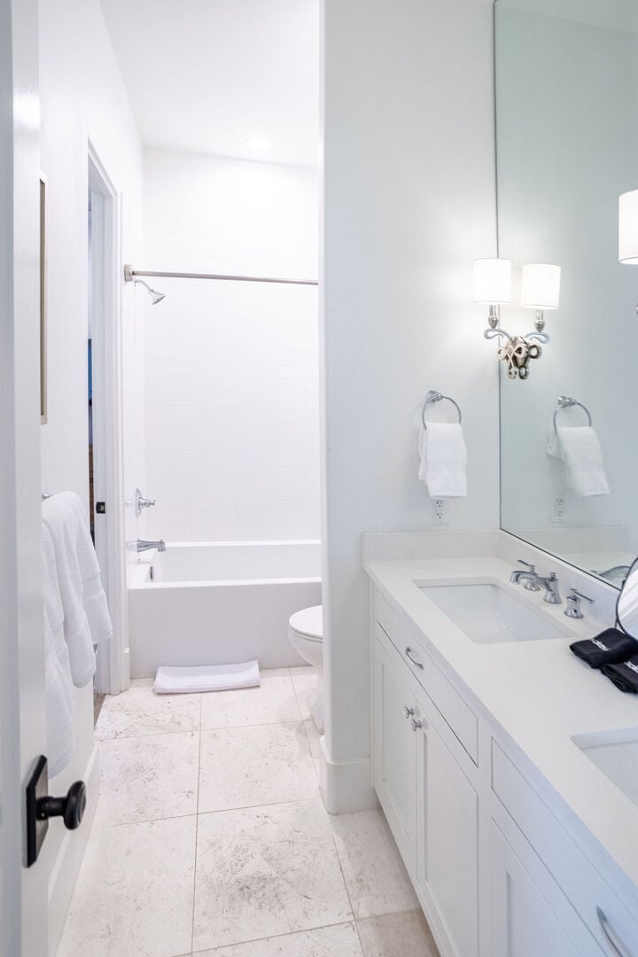 Jack-n-Jill bathroom between bedroom #2 and #3 complete with a shower/tub combo.