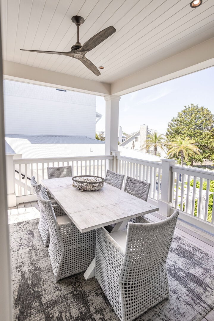 Outdoor dining area off kitchen has 6 seats.