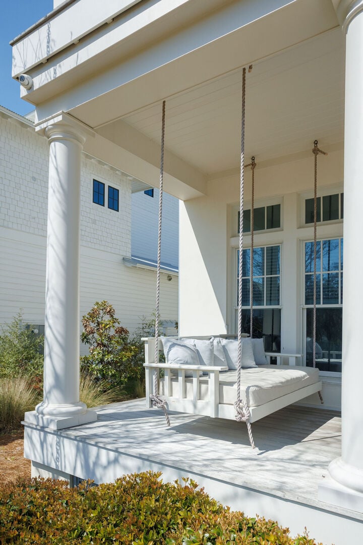 Large first floor patio has two porch swings and plenty of seating!