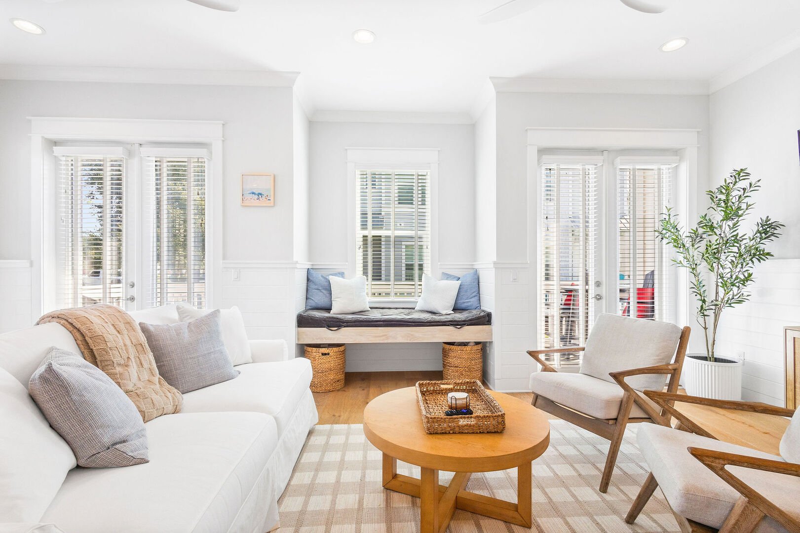 Plenty of seating in the living room space for the family.