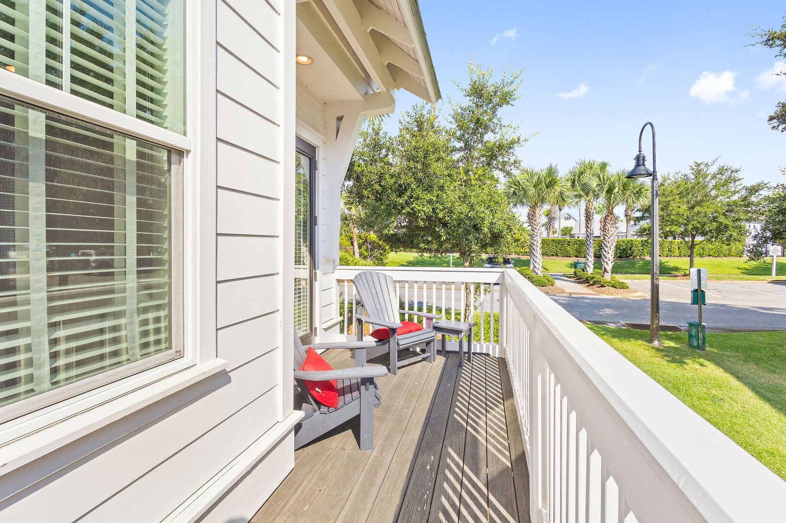 Large private patio with seating off living room.