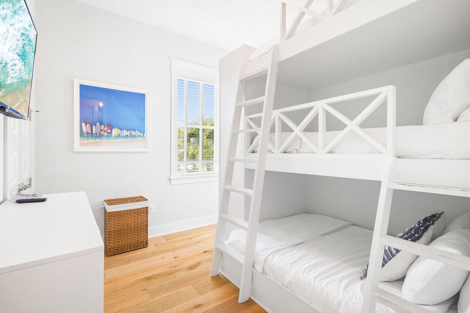 Bedroom #2 features twin over twin over full bunk beds and a smart tv.