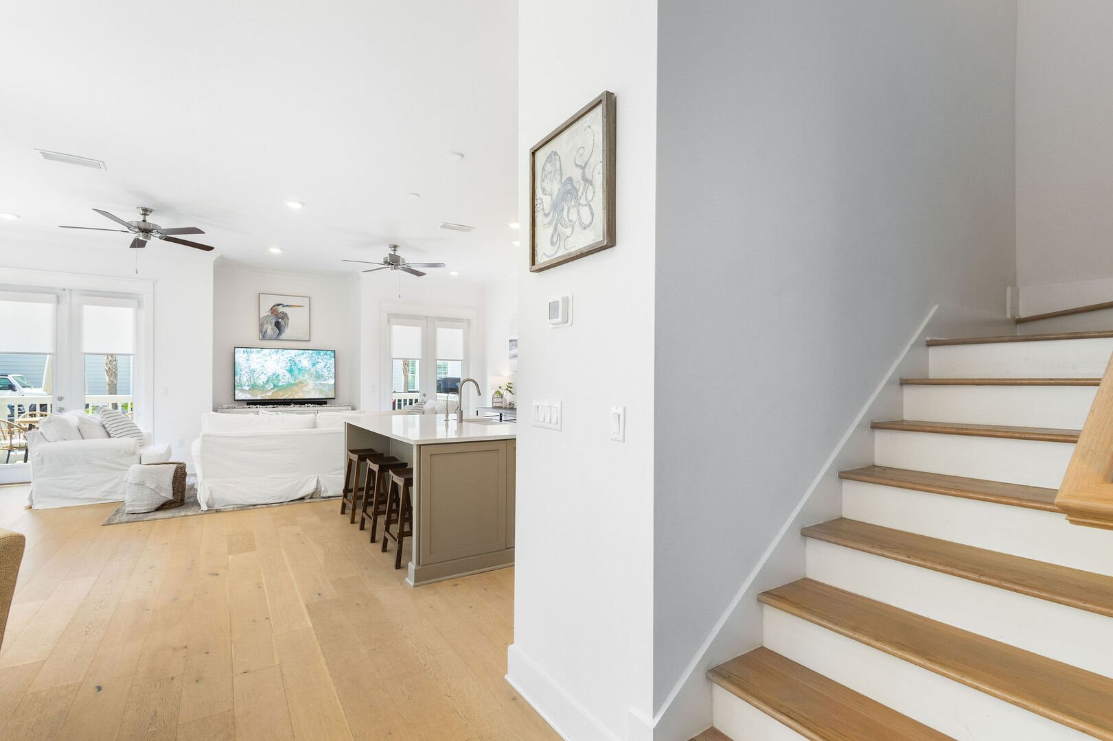 Stairs lead to three bedroom on 2nd floor.