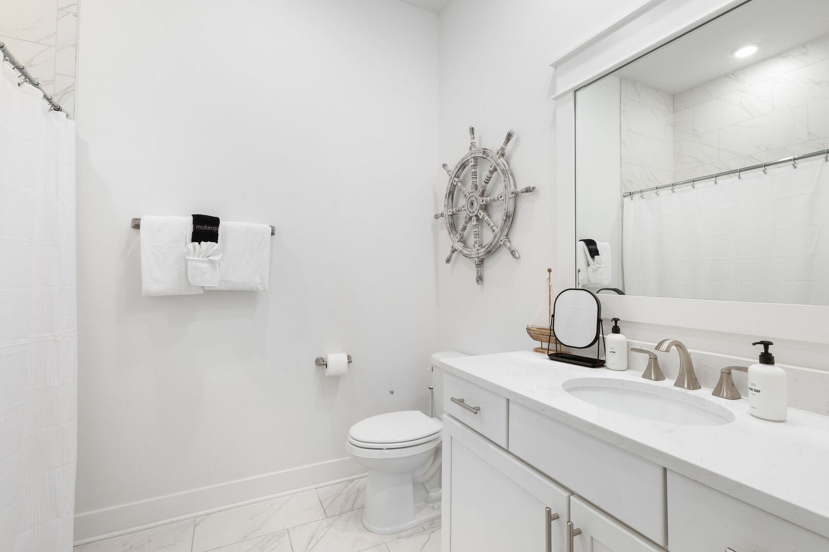 Second floor full bath features a shower/tub combo.