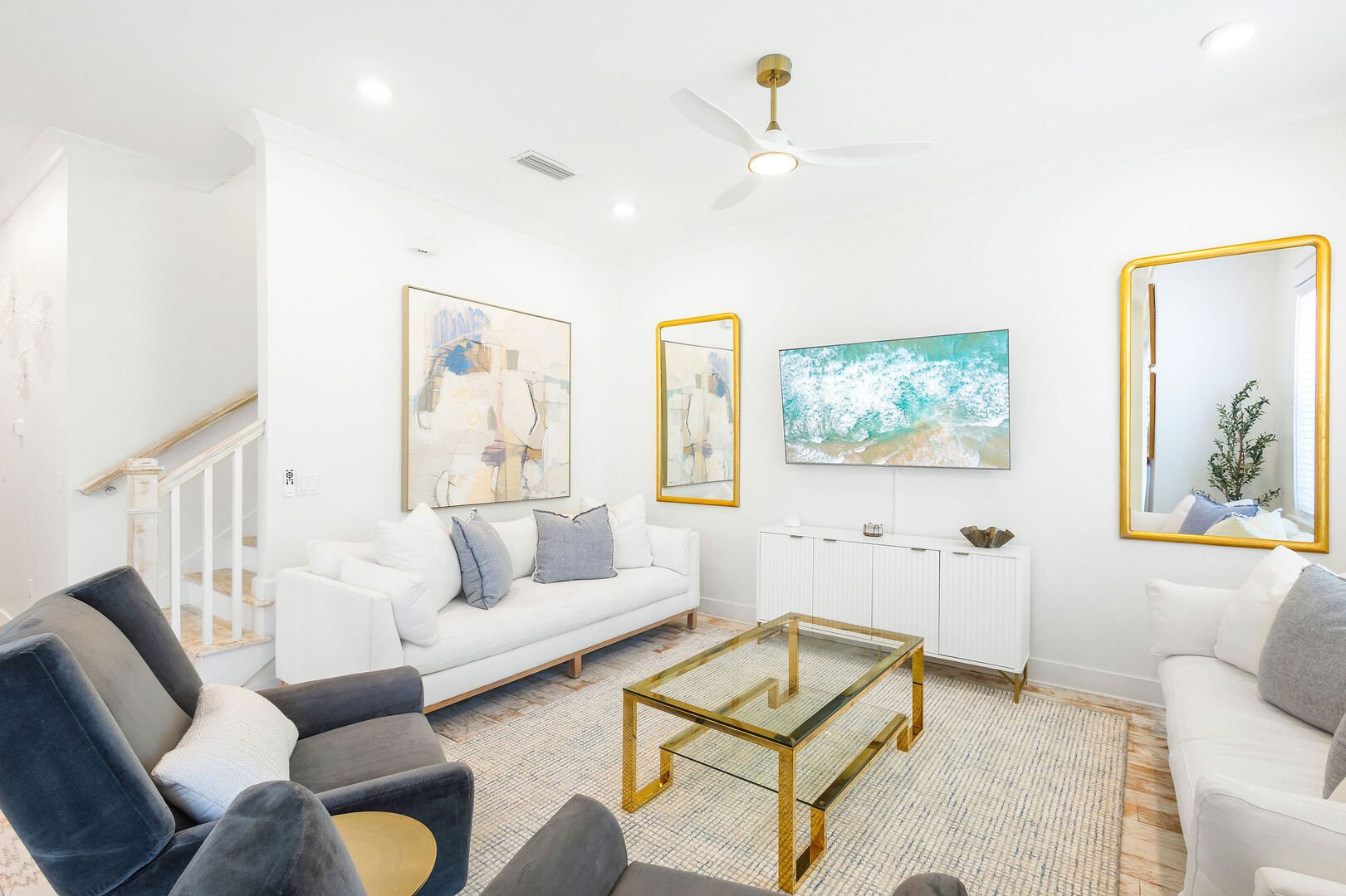 Living room space has a smart tv and plenty of seating for the family!