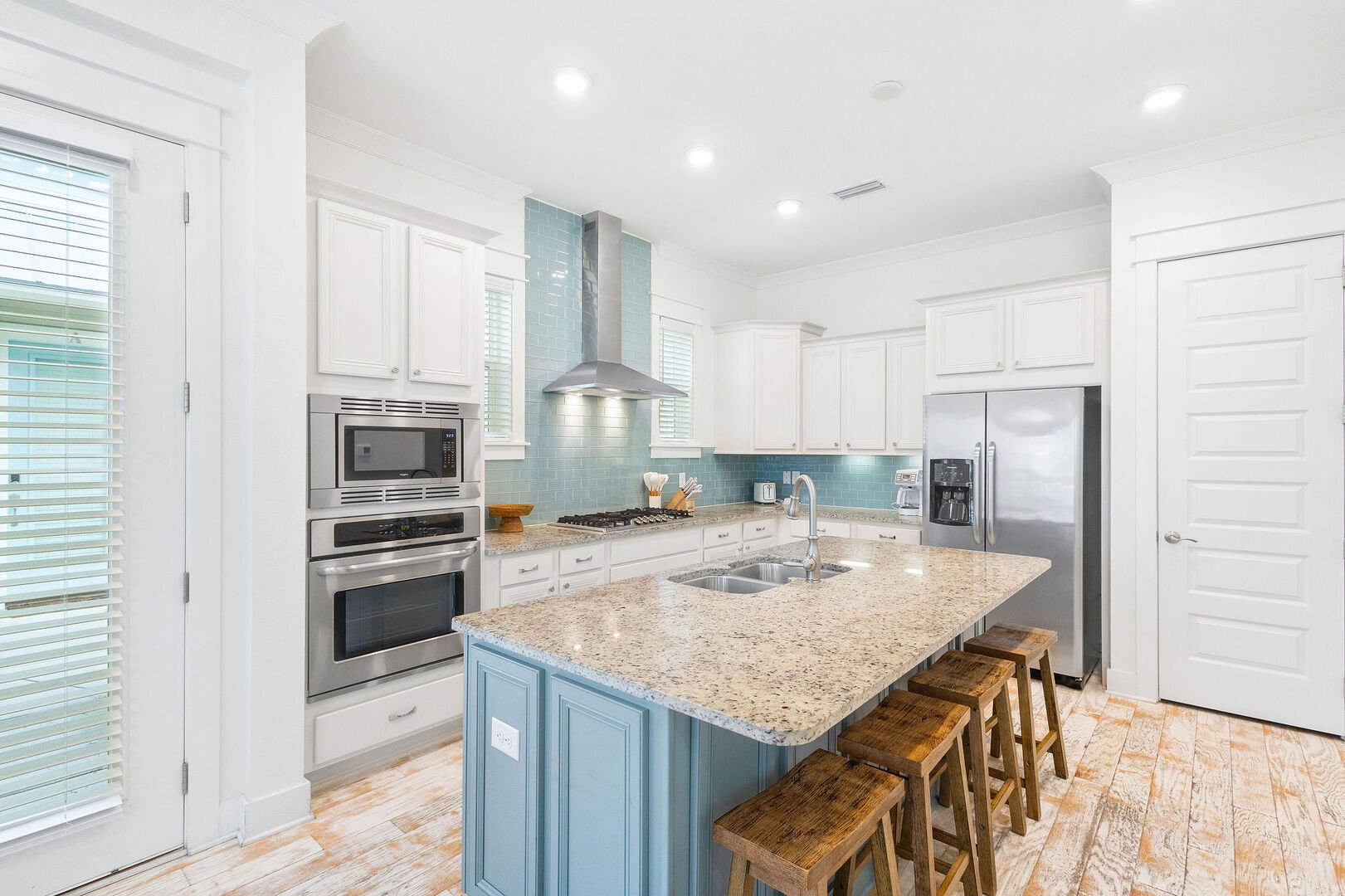 Large kitchen island includes seating for 4.