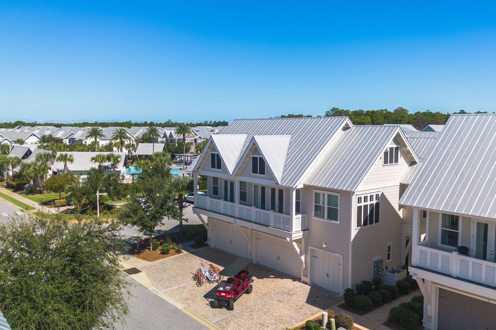 Home is steps from the resort-style community pool and includes a 6 seater golf cart and 6 adult bikes!