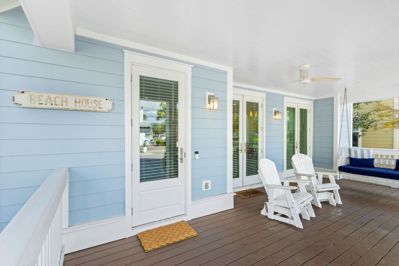 Large front porch with seating.