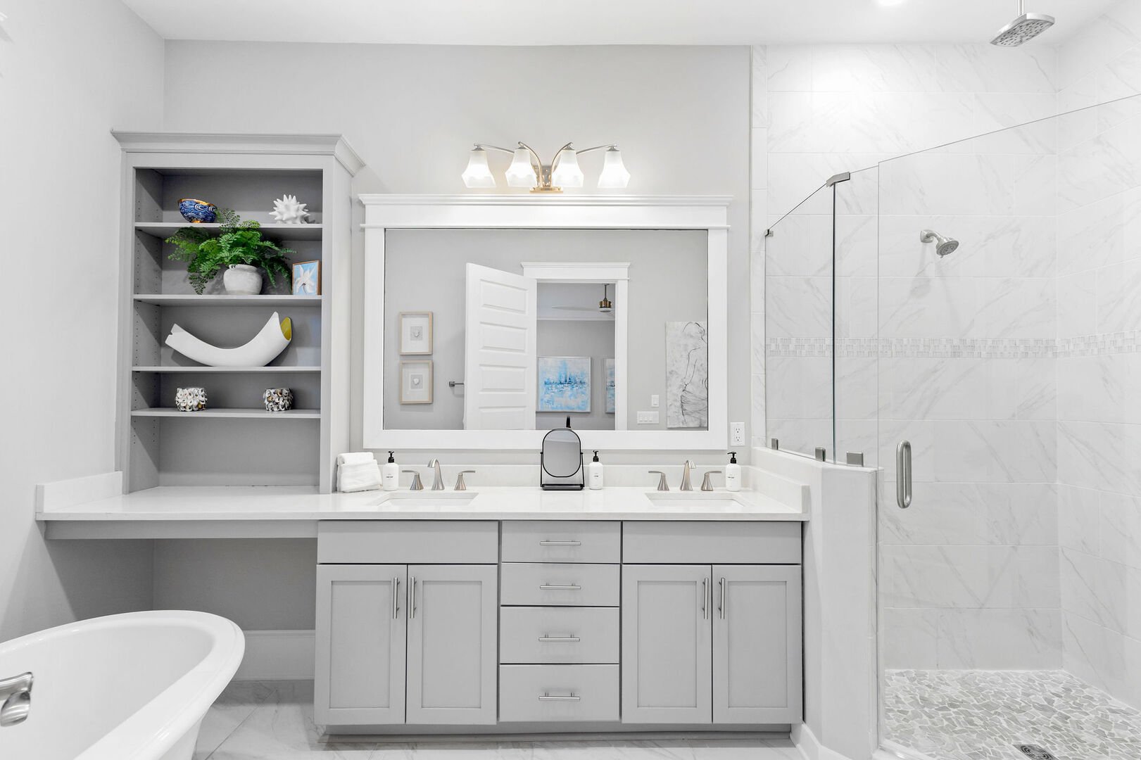 Bathroom features, dual vanities, walk-in shower and soaker tub.