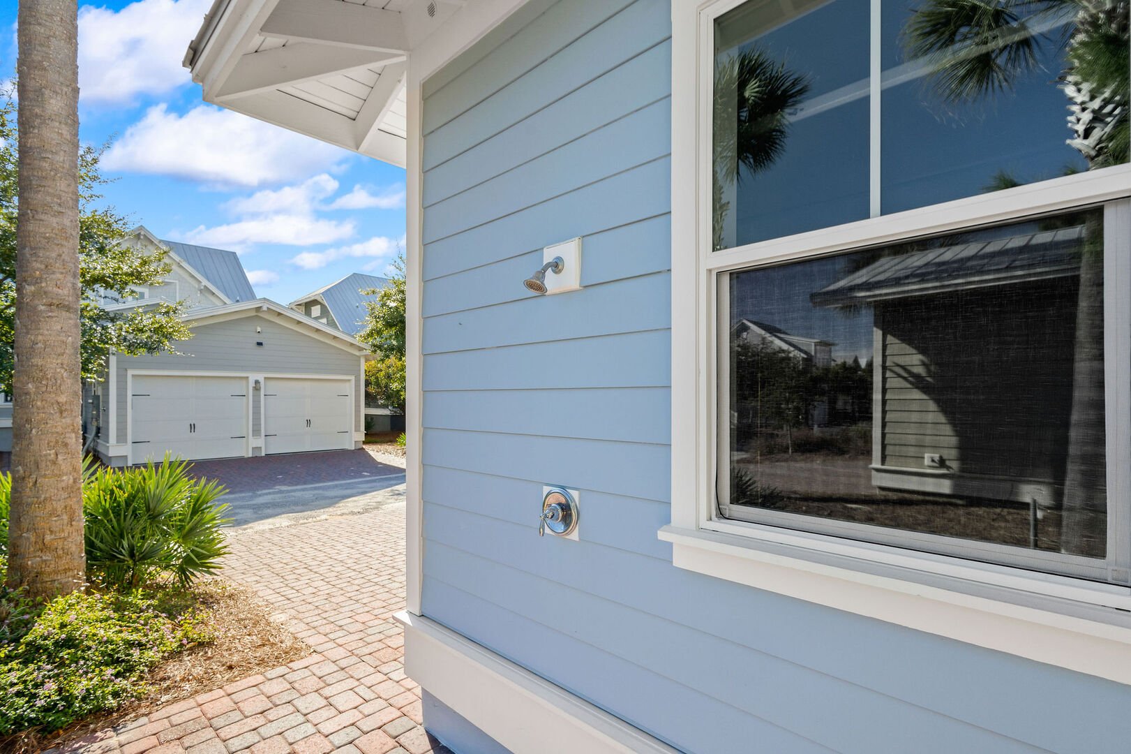 Home features an outdoor shower to rinse after a day at the beach!