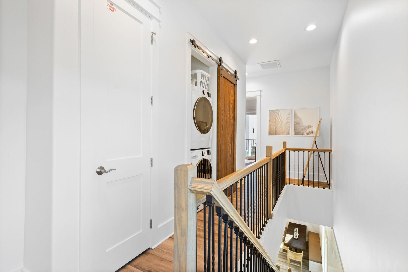 Third floor laundry featuring a full washer and dryer.