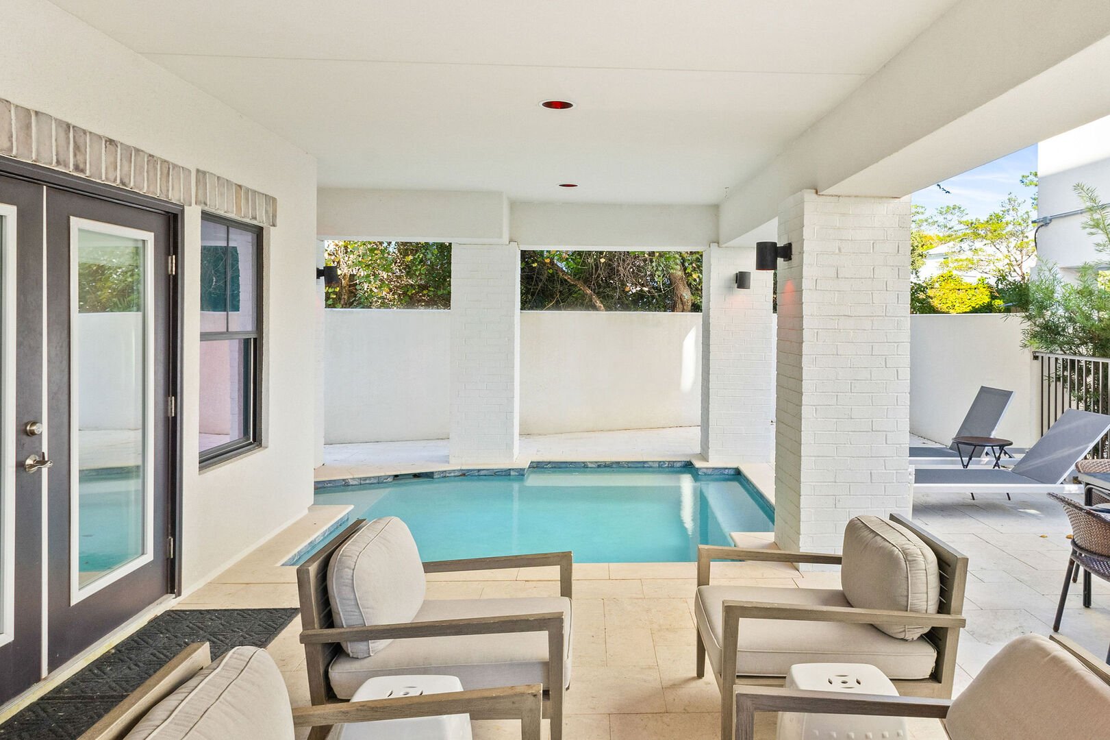 Home features a lovely covered pool.