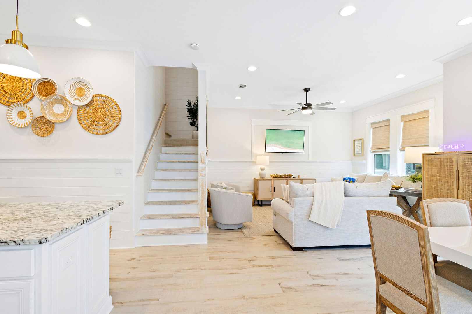 Staircase leads to bedrooms on the second floor.