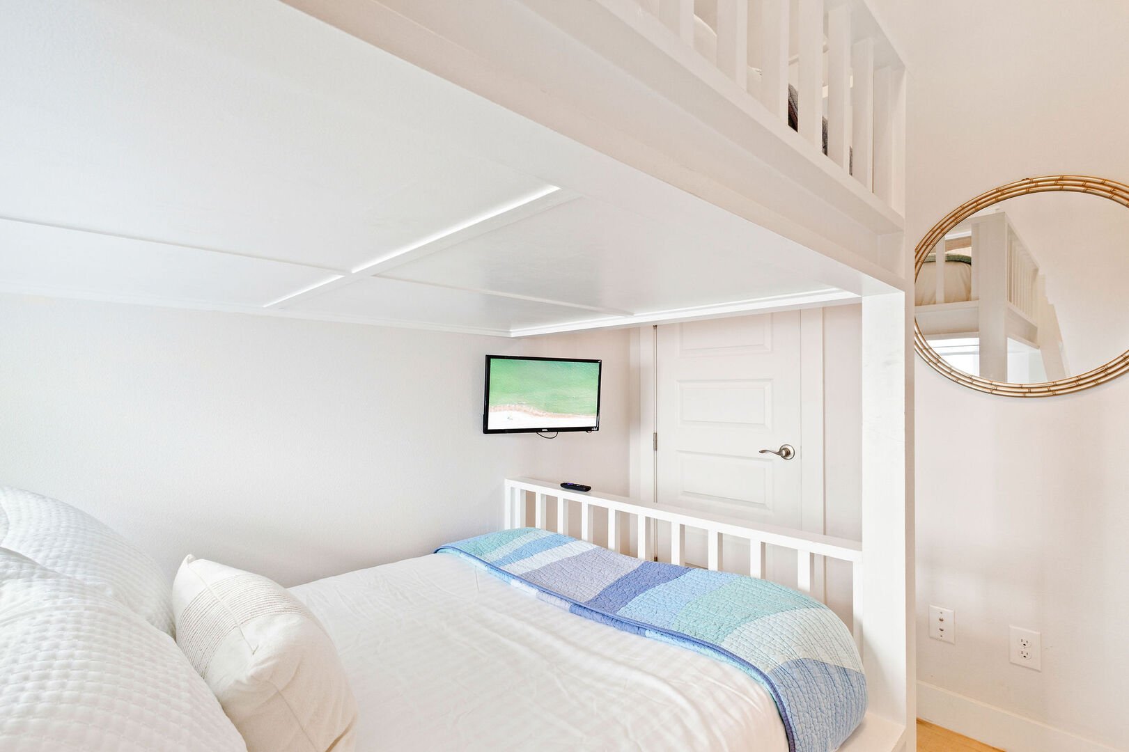 Bedroom features two smart tv's.