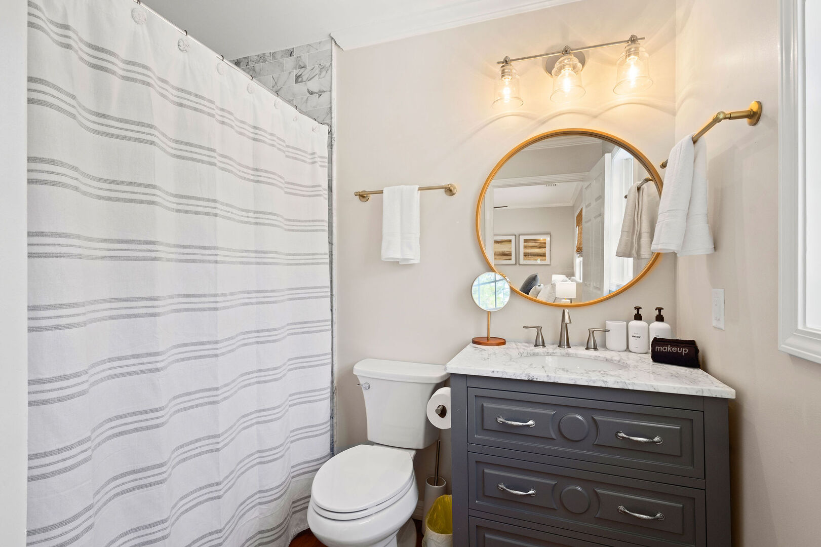 Bathroom features a shower/tub combo.