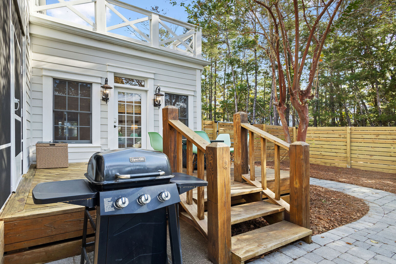 Back patio features a gas grill for afternoon cookouts by the pool.