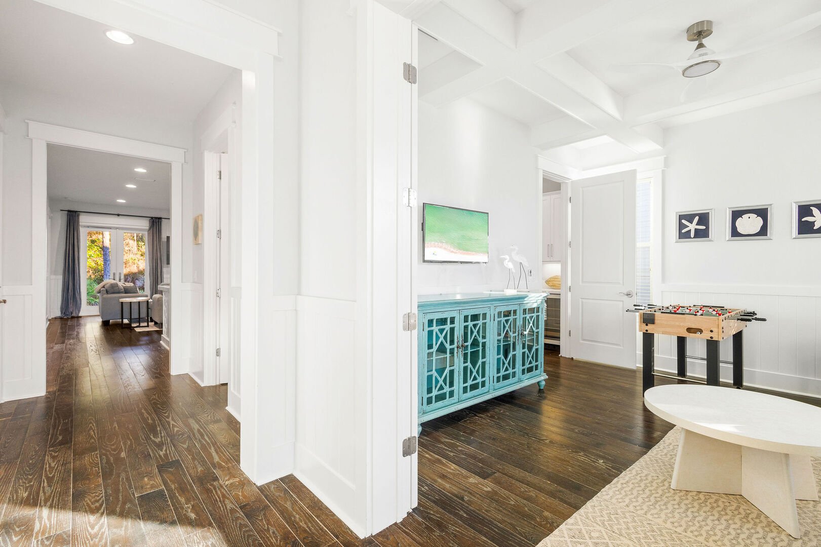 Upon entering the home, you are welcomed by a game room off to the right.