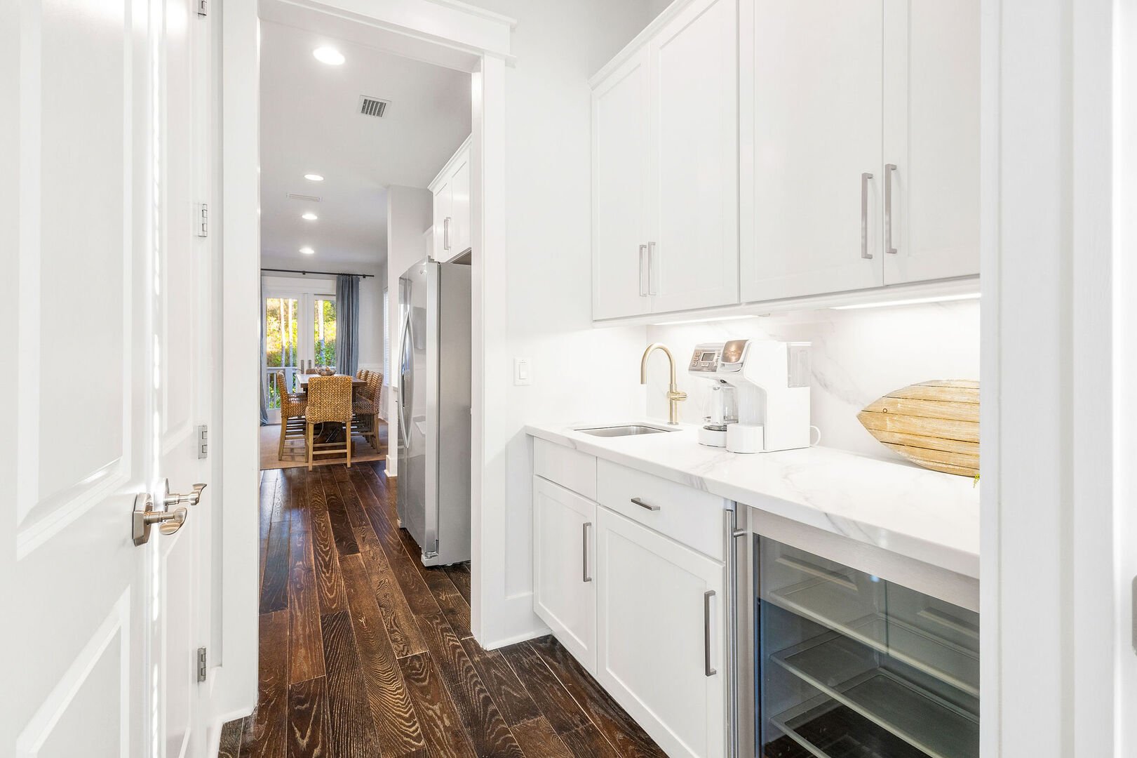 Kitchen features a butler pantry with a beverage cooler.