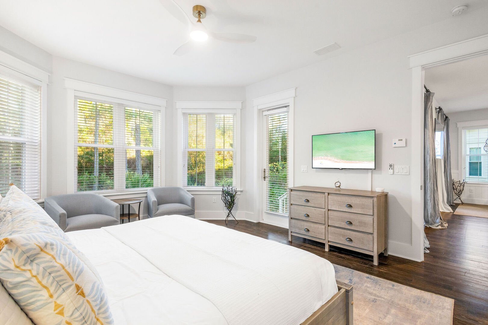 Bedroom #1 features a king bed, smart tv and ensuite. Bedroom features a walkout to back patio.