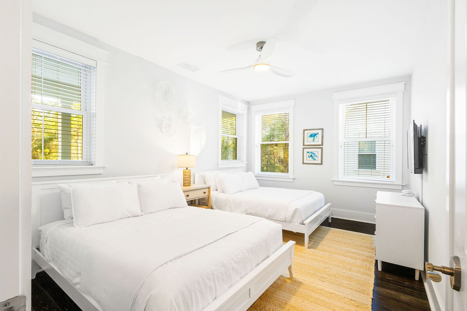 Bedroom #2 features (2) queen beds, a smart tv and ensuite.