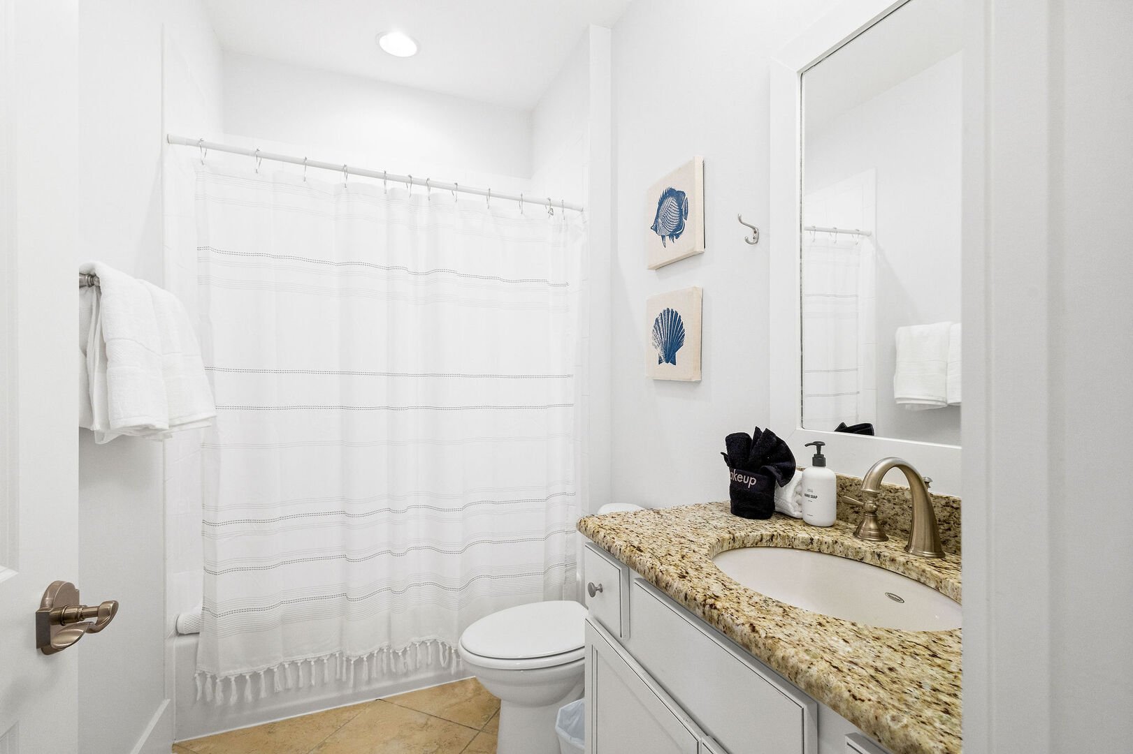Second floor full bathroom features a shower/tub combo.