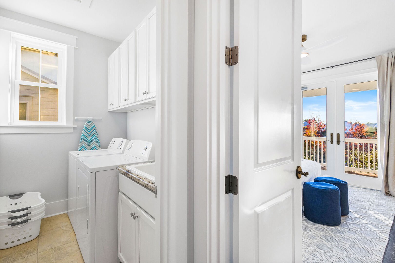 Second floor laundry room features a full wash and dryer.