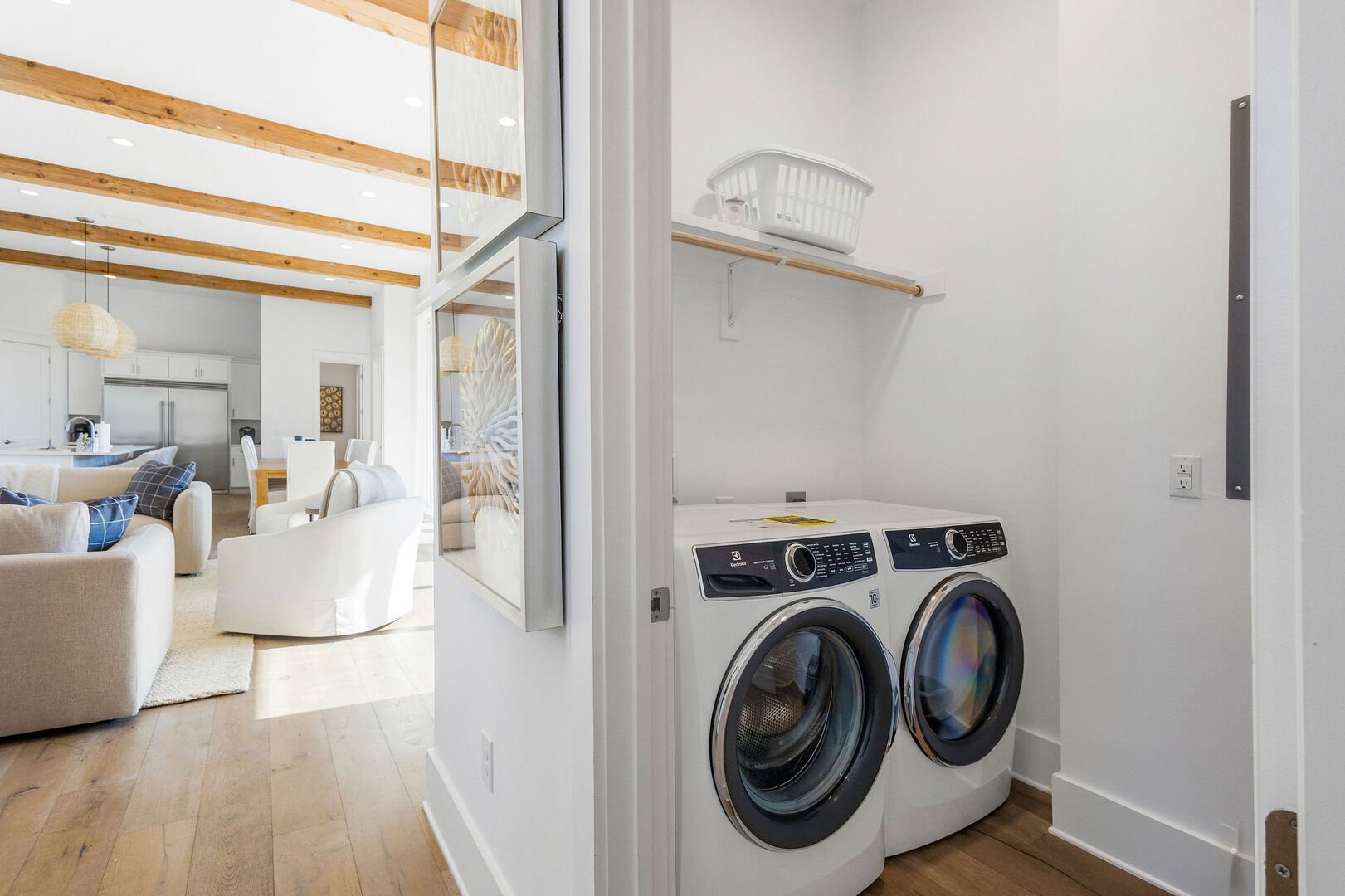 Second floor laundry features a full washer and dryer.