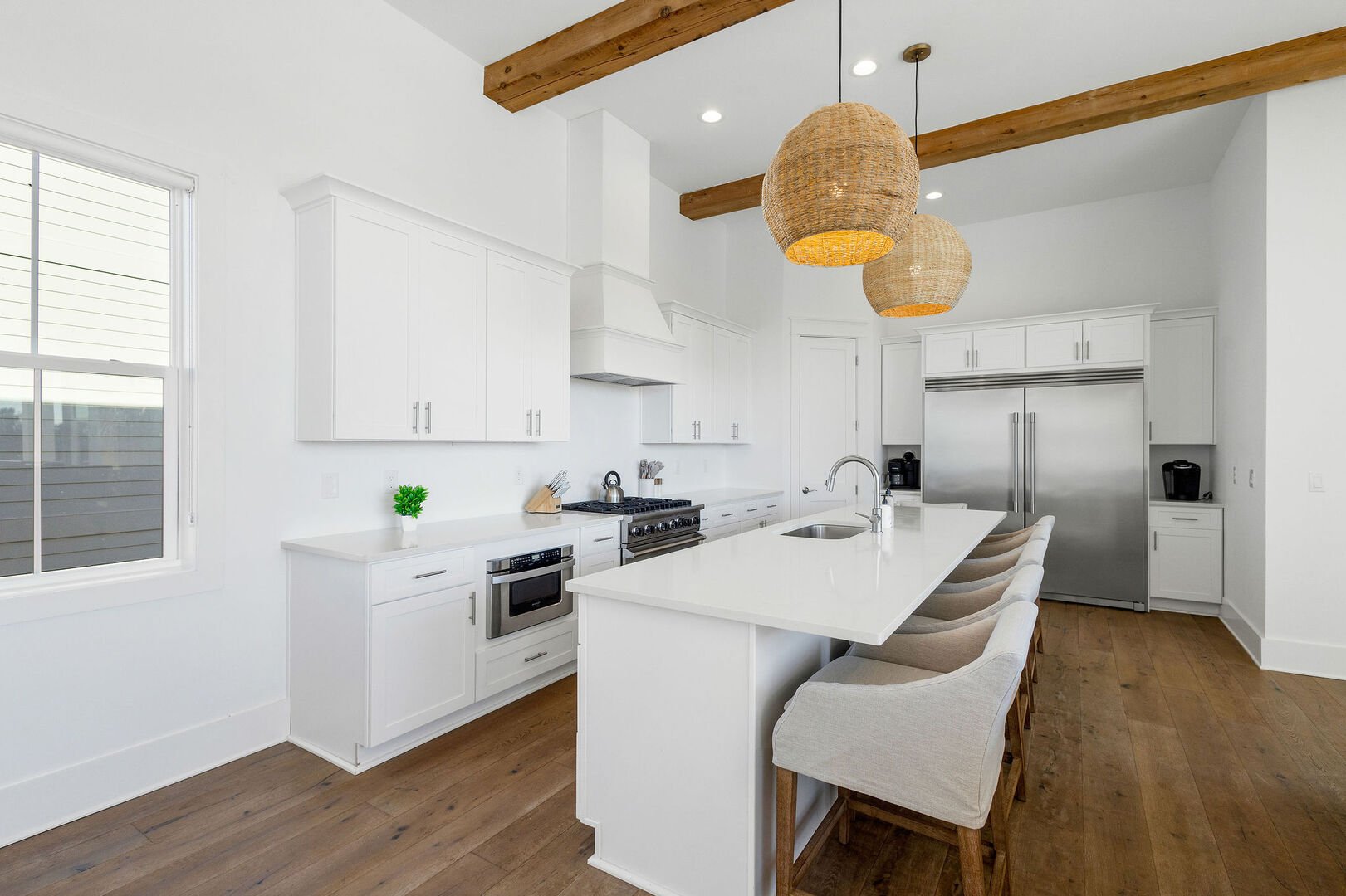 Large kitchen island features seating for 4.