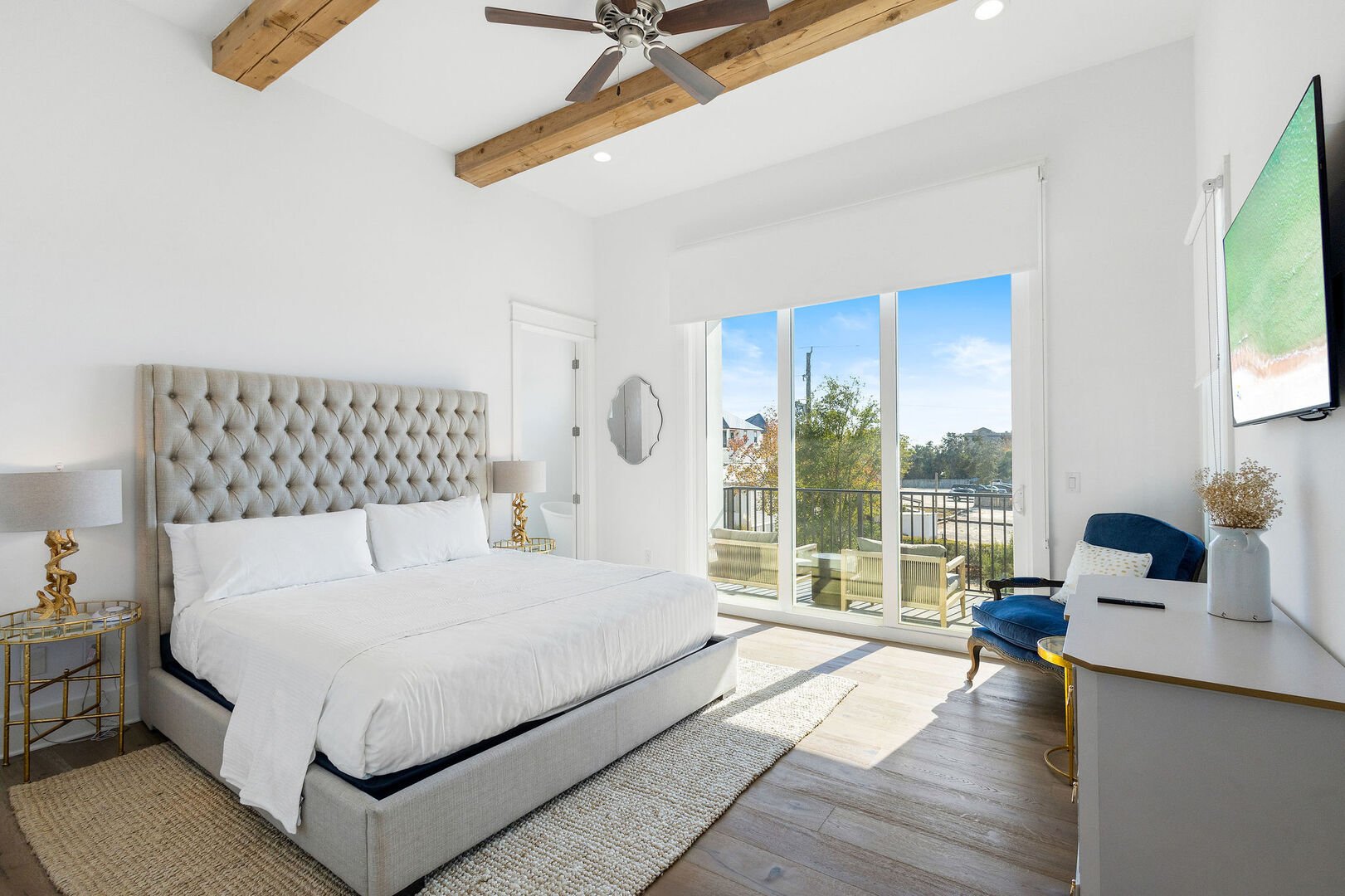 Bedroom #6 features a king bed. smart tv, walkout to private balcony and ensuite.