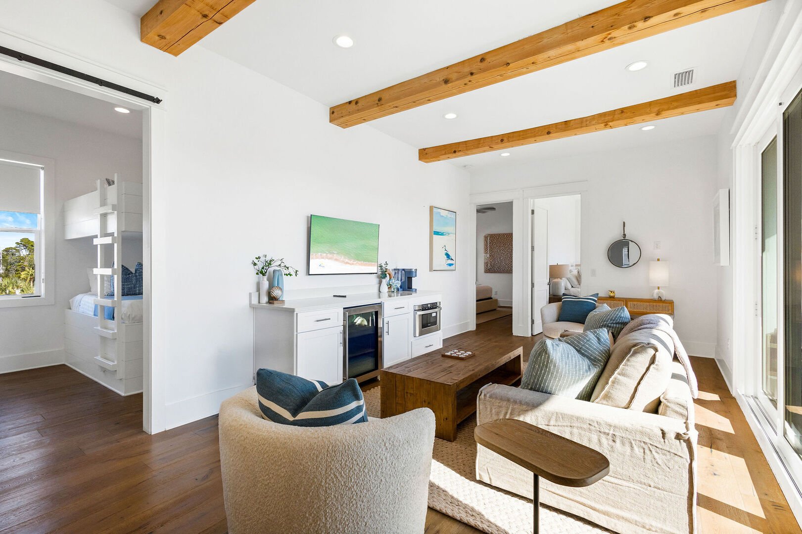 Third floor living area features seating and a smart tv.