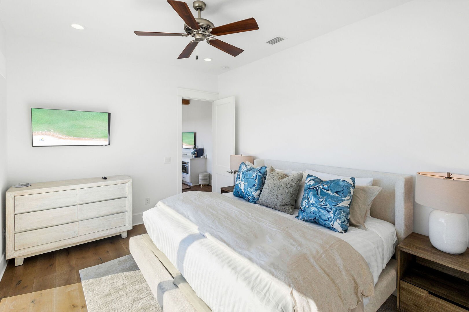 Bedroom #9 features a king bed, smart tv, balcony walkout and ensuite.