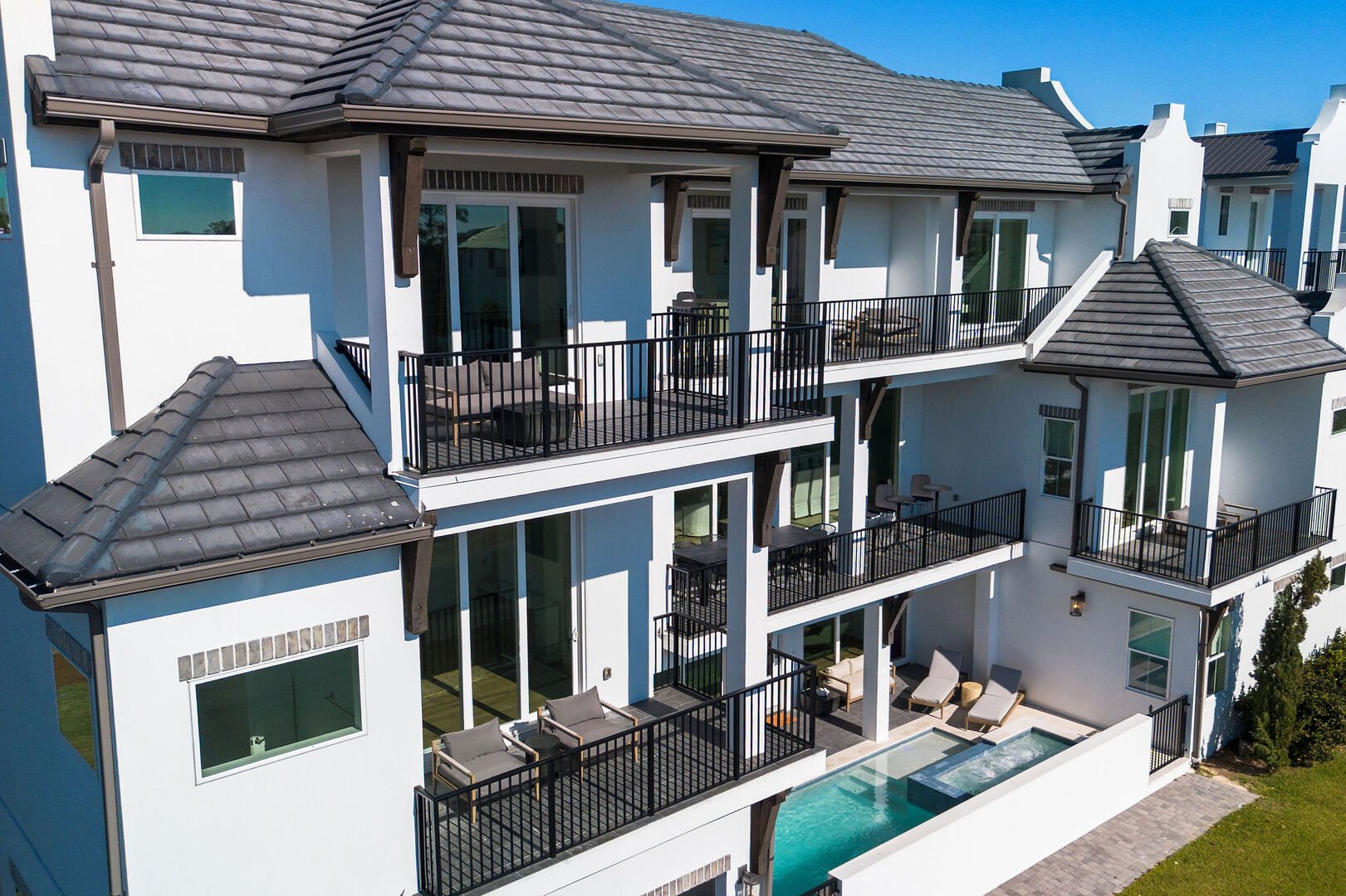 Balconies span the front of the home on each floor. Some offer Gulf views!