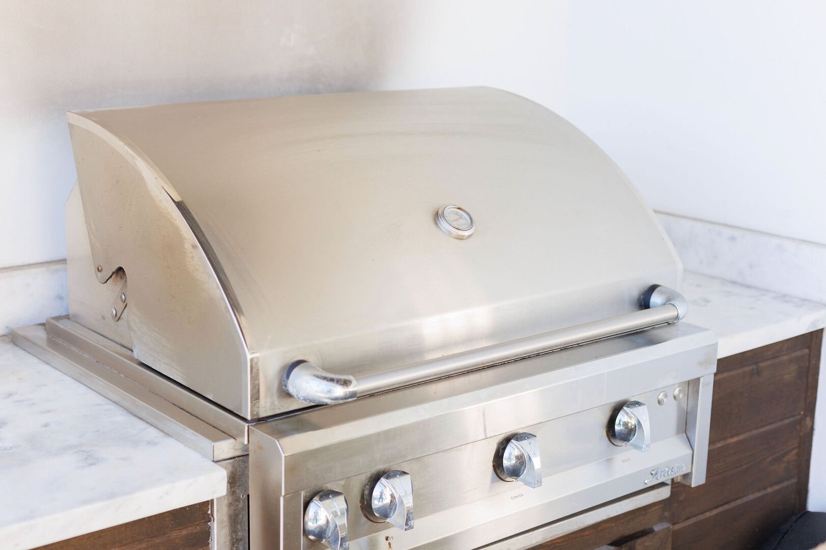 Patio features a gas grill. Perfect for cookouts by the pool!