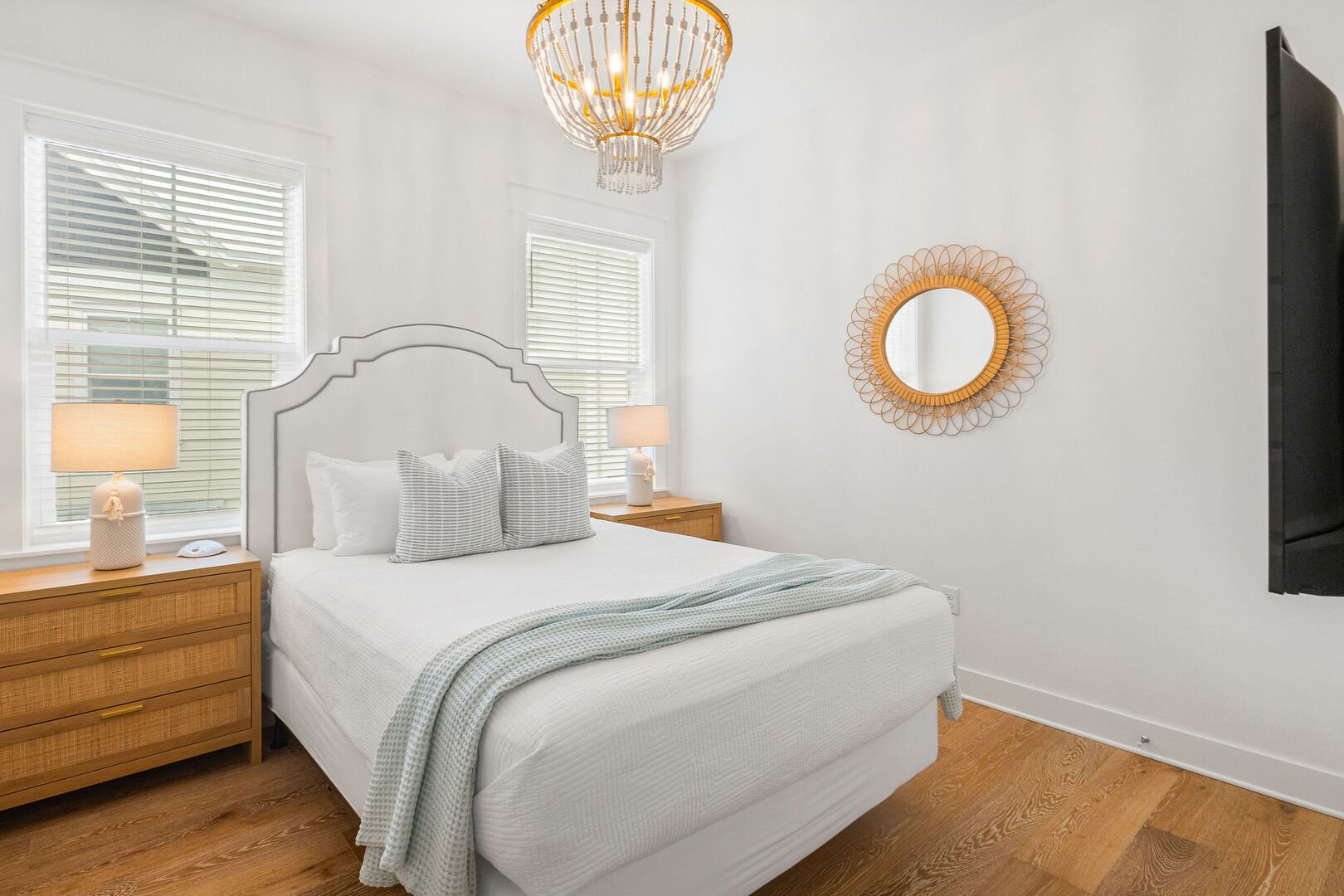 Bedroom #1 features a queen bed and smart tv.