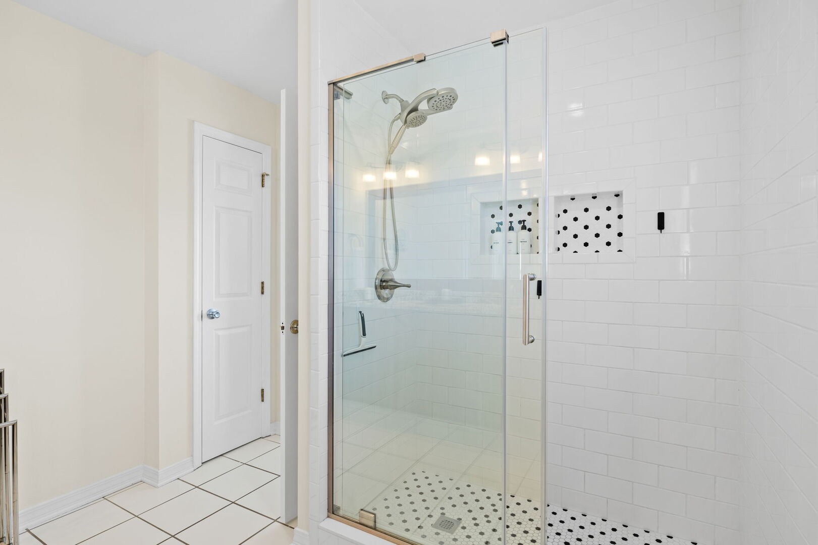 Bedroom #3 features an ensuite with dual vanities and a walk-in shower.