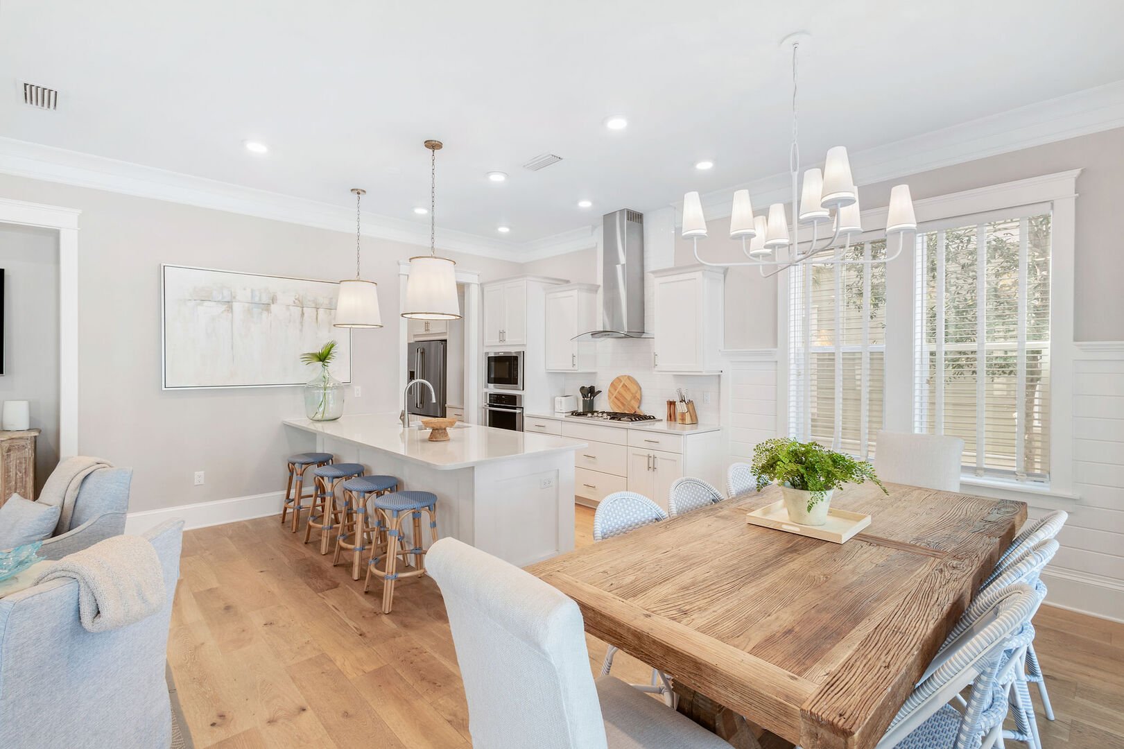 Dining room table feature seating for 8, with an additional 4 seats at the large kitchen island.
