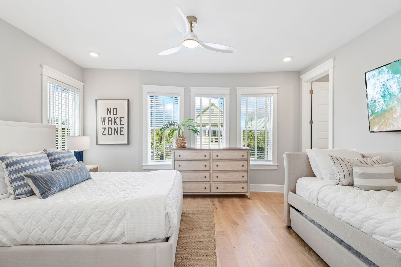 Bedroom #2 features a queen bed, a twin bed with a twin trundle, a smart tv and ensuite.