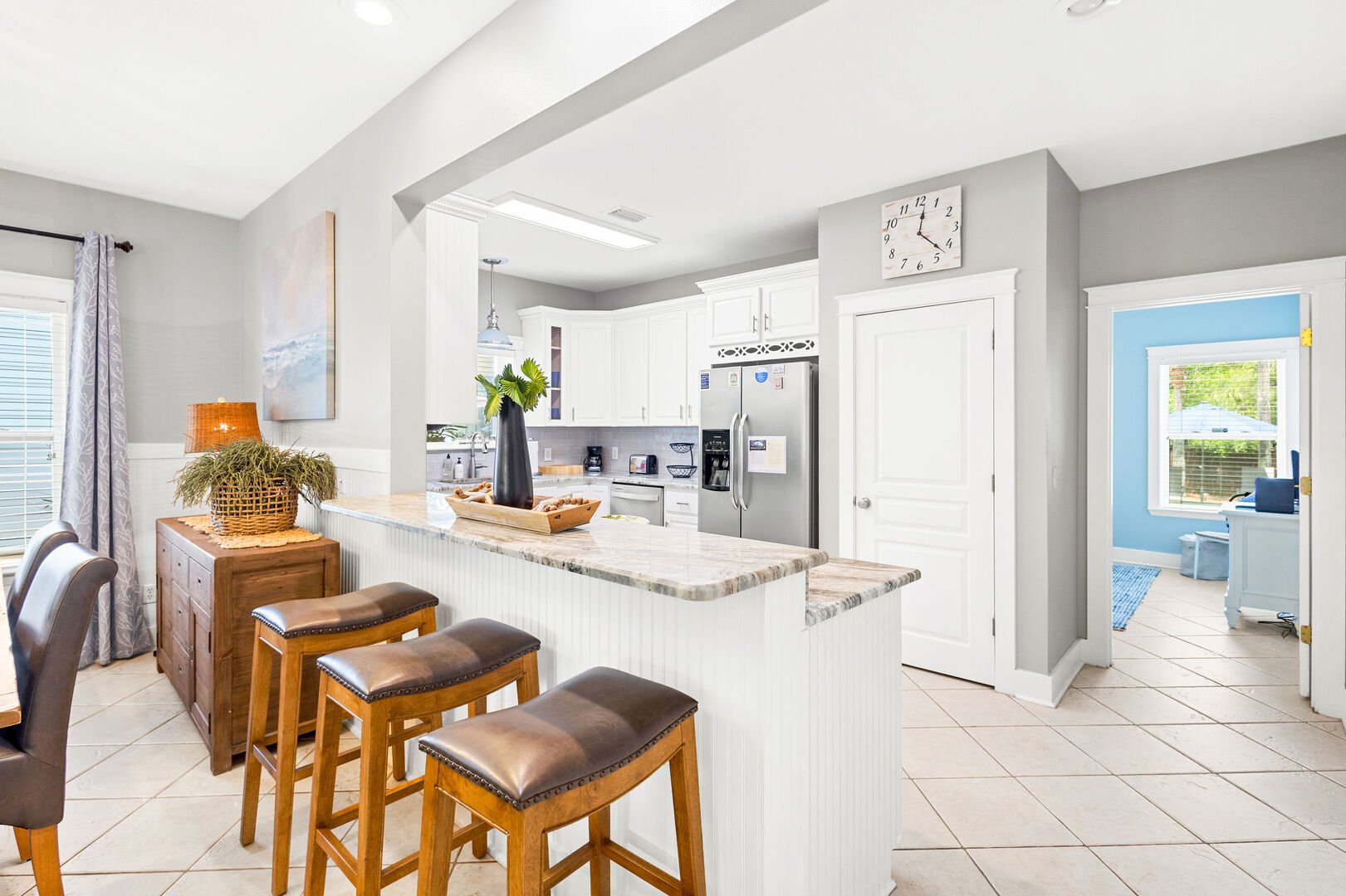 Kitchen island includes additional seating for 3.