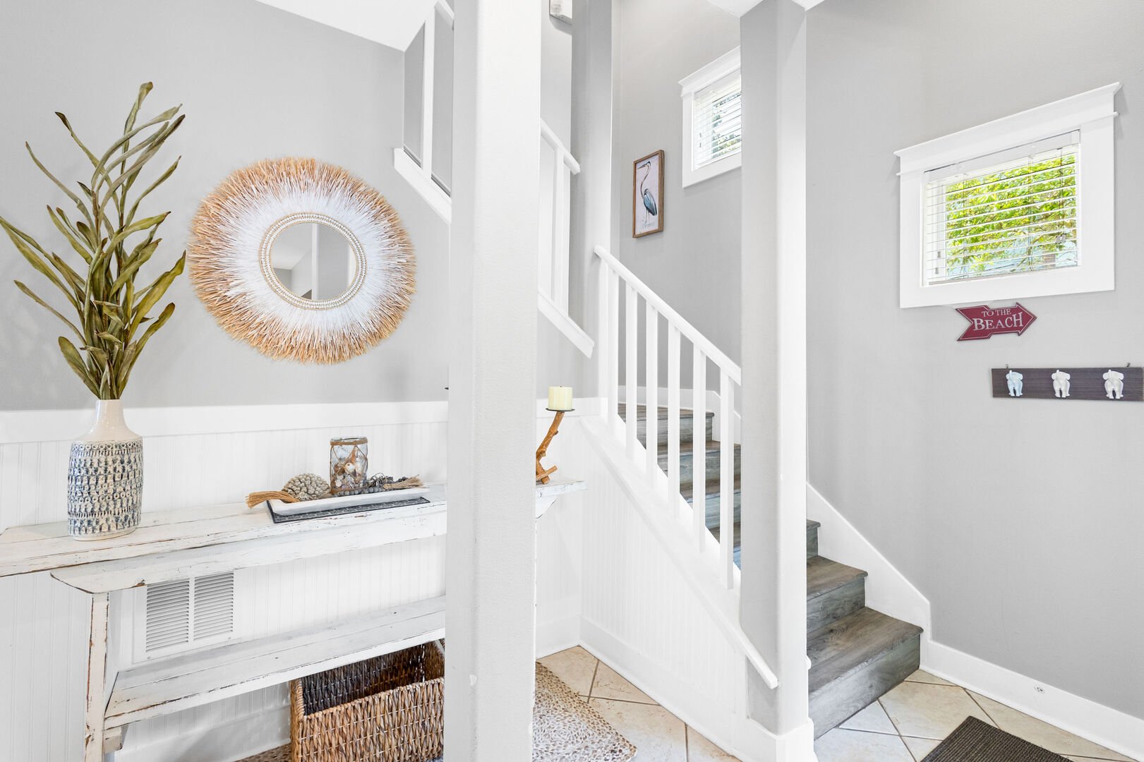 Stairs lead to the second floor featuring two additional bedrooms.