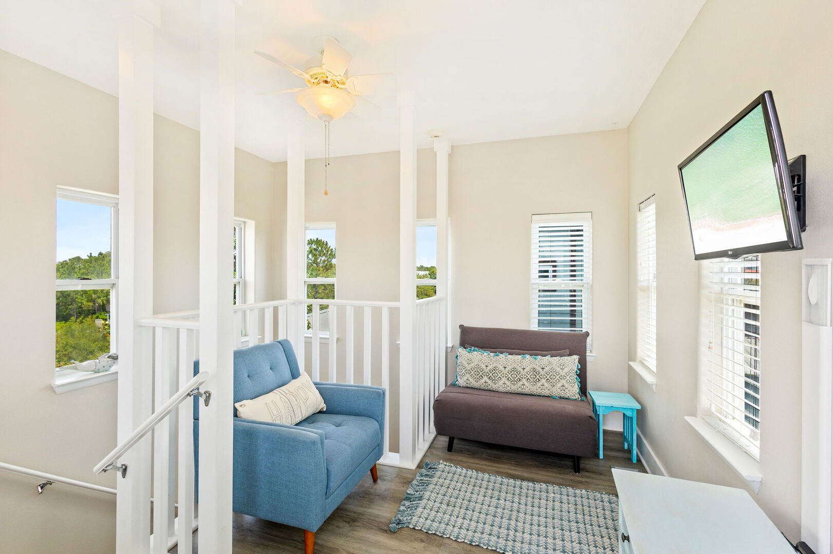 Third floor features seating and a smart tv perfect for entertainment and family game night.